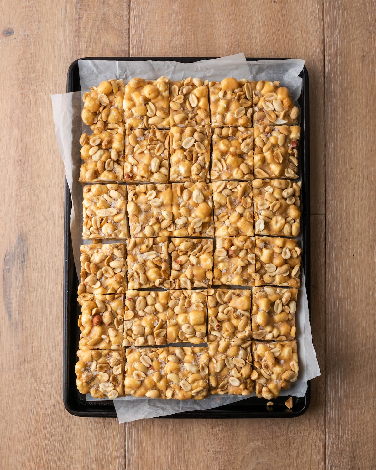 Top view of a slab of homemade PayDay candy cut into bars.