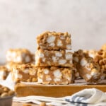 Three homemade PayDay bars stacked on top of one another, surrounded by the other bars.