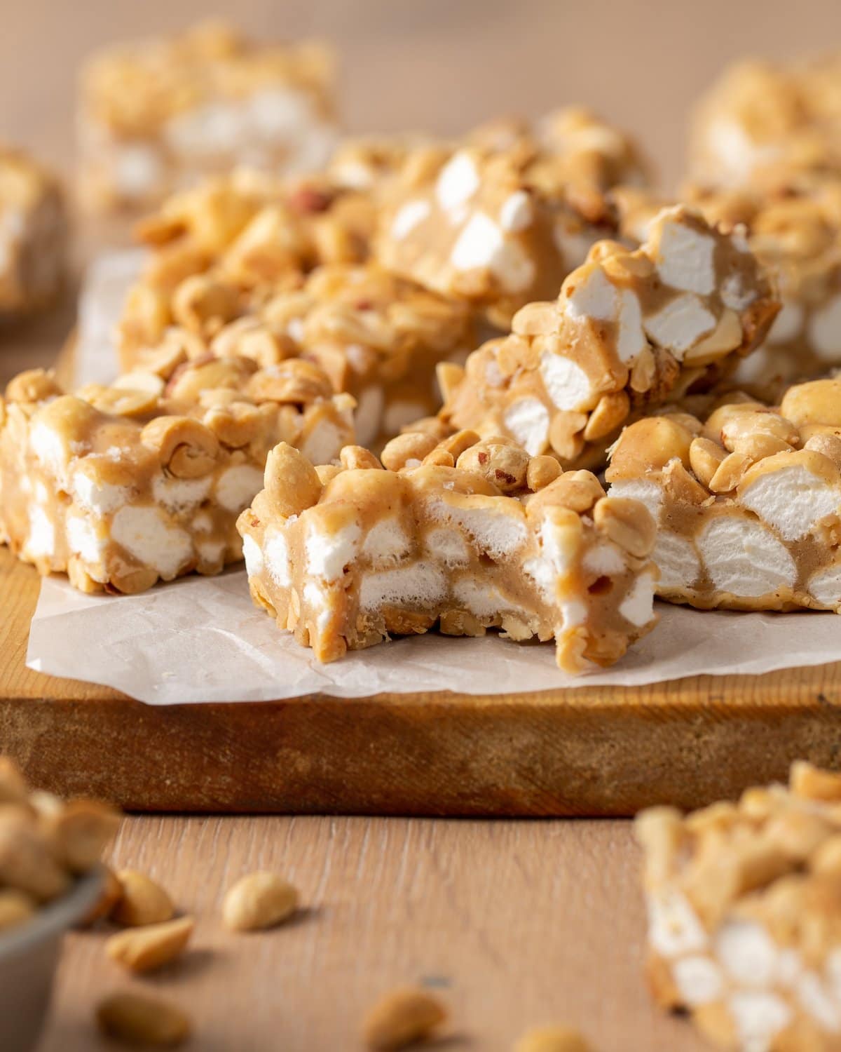 A bite missing from a homemade PayDay bar, with more bars in the background.