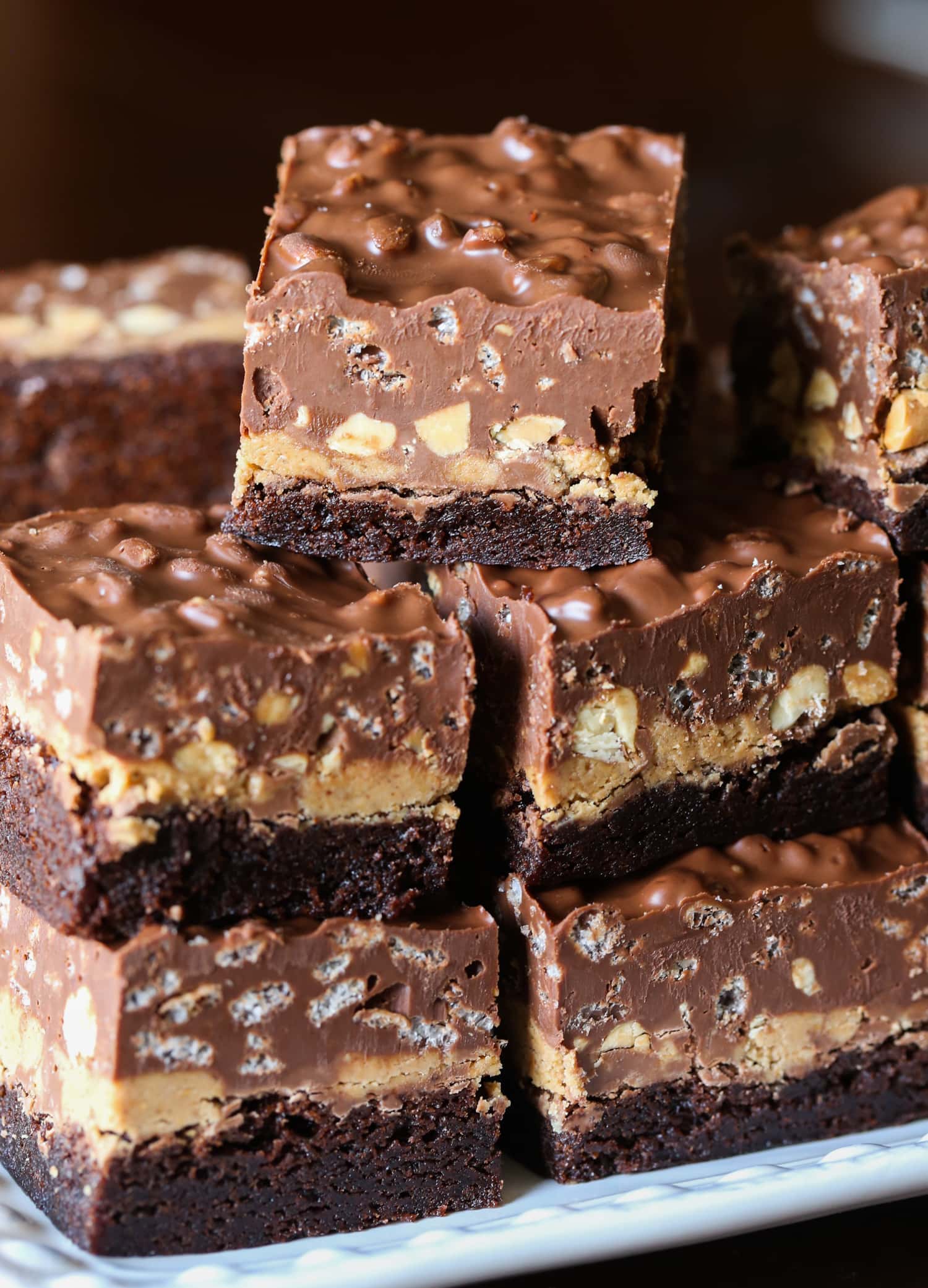 Peanut Butter Cup Crack Brownies stacked on a plate