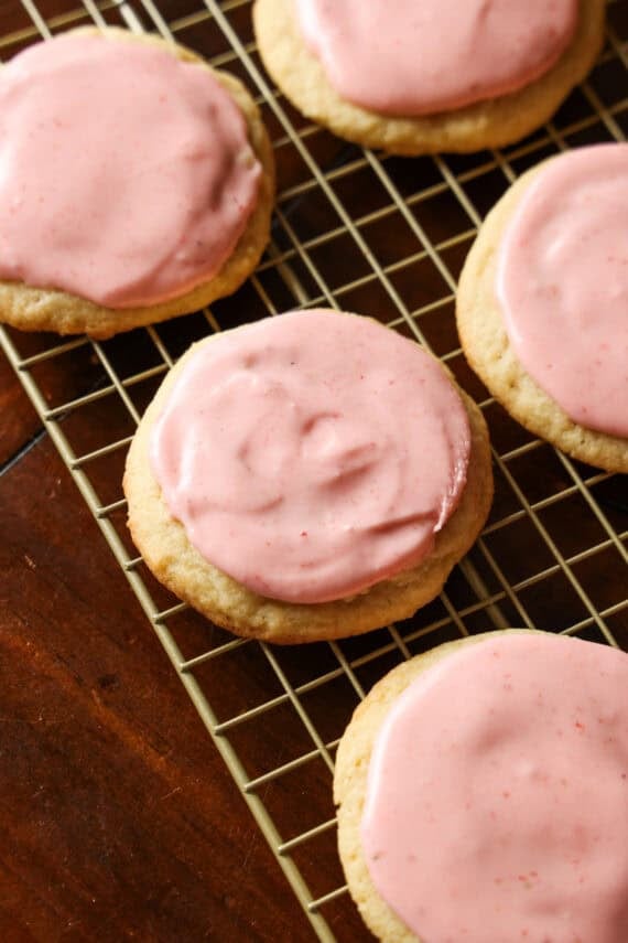 Sugar cookies topped with pink strawberry frosting