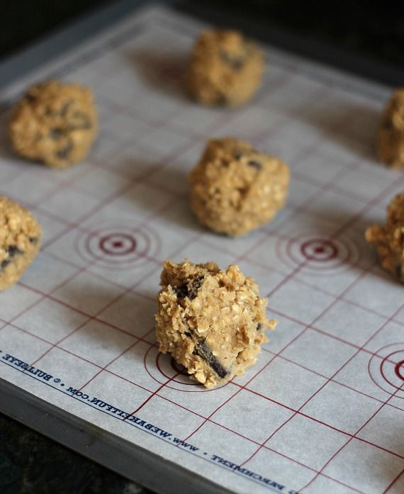 Oatmeal chocolate chip cookie balls on a baking mat