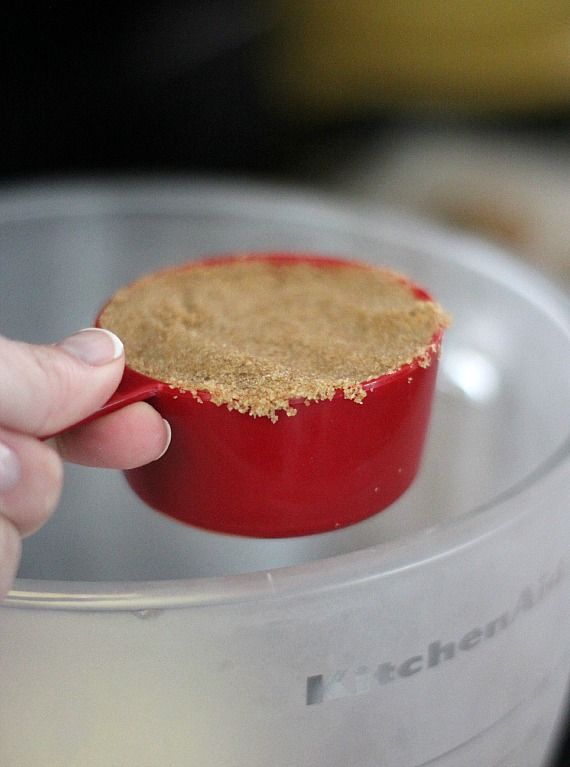 A measuring cup of packed brown sugar