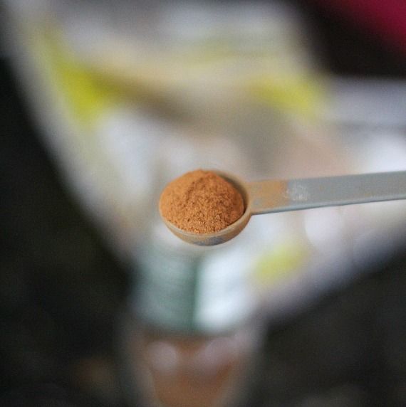 Ground cinnamon in a measuring scoop