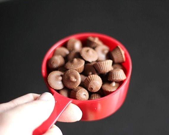 Mini peanut butter cups in a measuring cup