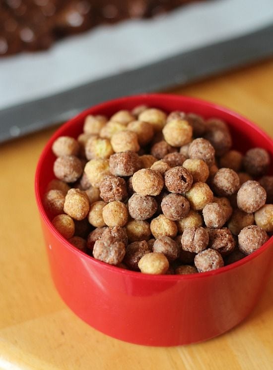 Chocolate peanut butter cereal puffs in a measuring cup