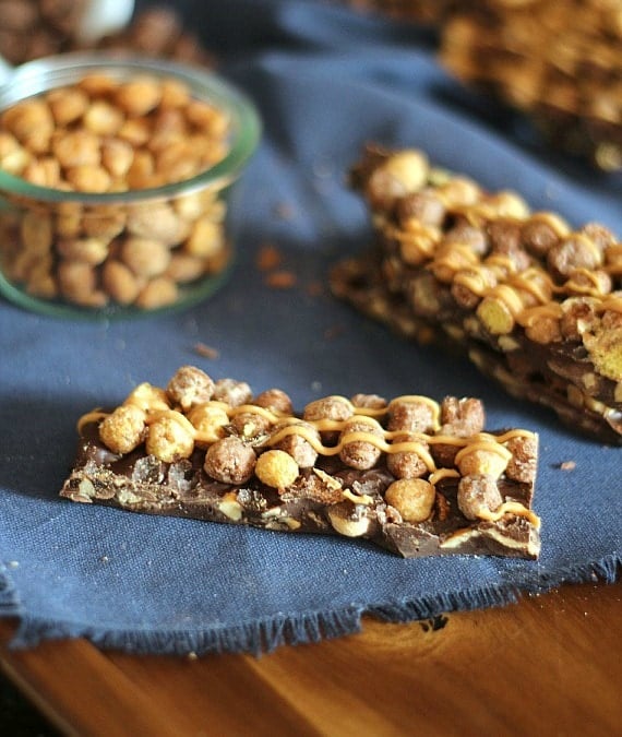 Peanut Butter Cup Candy Bars ~ A cross between a candy bar and bark, loaded with peanut butter cups, peanuts and Reese's Puffs Cereal!