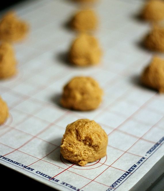 Cookie dough balls on a baking mat