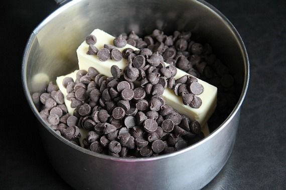 Top view of chocolate chips and butter in a saucepan