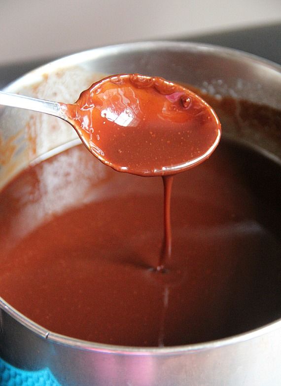 Melted chocolate and butter in a saucepan with a spoon