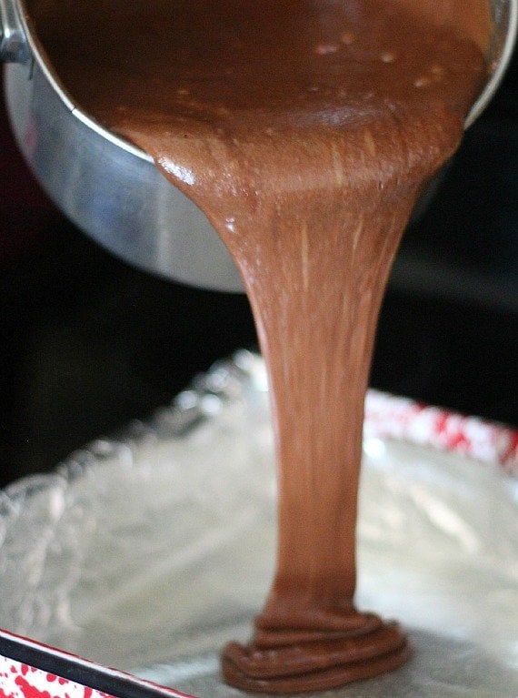 Brownie batter being poured into a pan