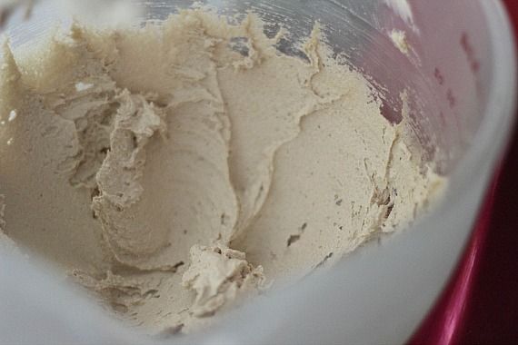 Overhead view of butter and sugars creamed together in a bowl