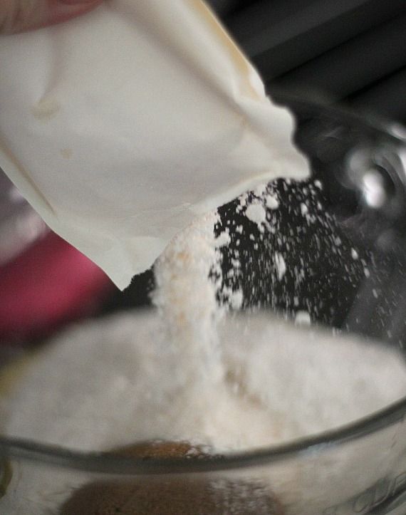 White powdered mix being poured into a mixing bowl