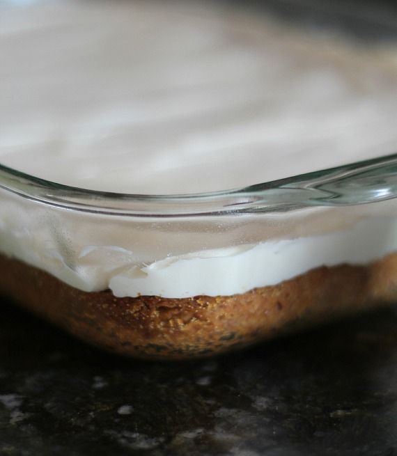 Close-up of cinnamon roll cookie bars topped with cream cheese frosting