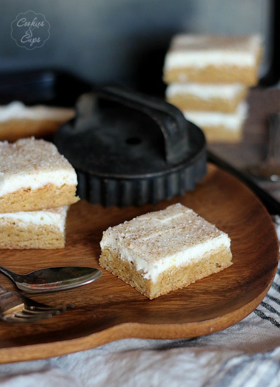 Cinnamon Roll Cookie Bars ~ Starts with a Cake Mix and is topped with delicious cream cheese frosting! www.cookiesandcups.com