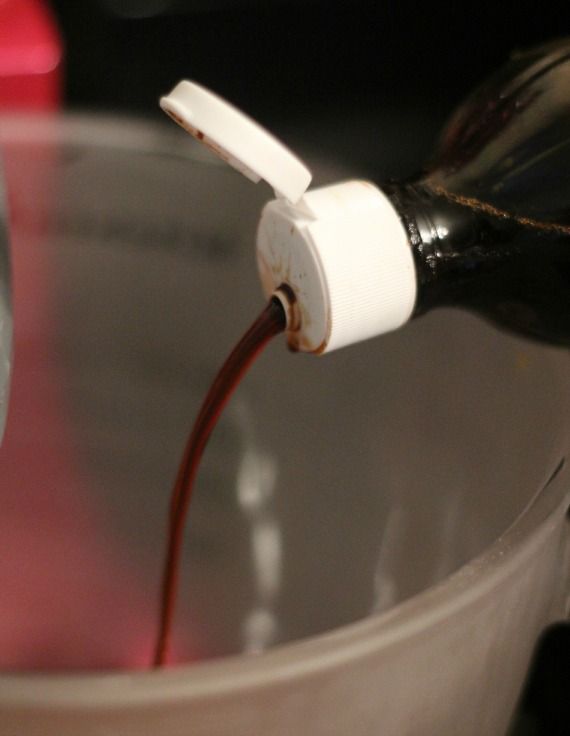 Vanilla extract being added to a mixing bowl