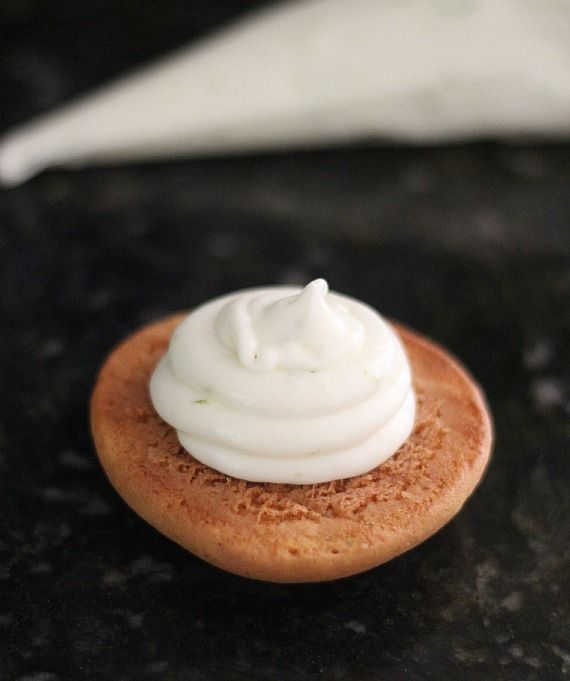 Half of a whoopie pie with a swirl of creamy lime filling