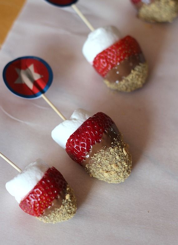 Strawberry S'mores skewers on parchment paper