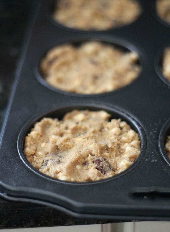 Smores cookie batter spread in a muffin top pan