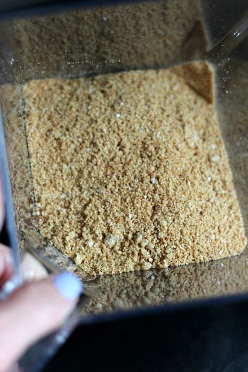Graham cracker crumbs in a plastic container