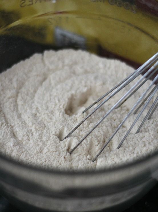 Dry ingredients for Malted Milk Cookies in a bowl with a whisk