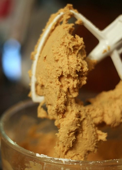 Thick peanut butter mixture in a stand mixer bowl