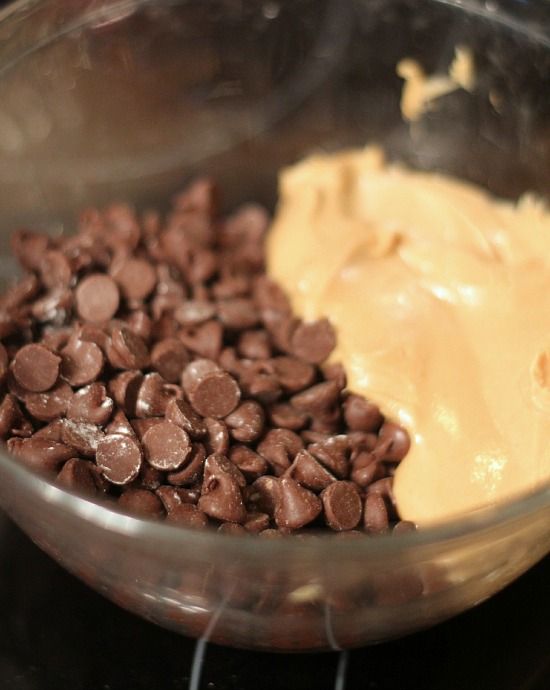 Peanut butter and chocolate chips in a glass bowl