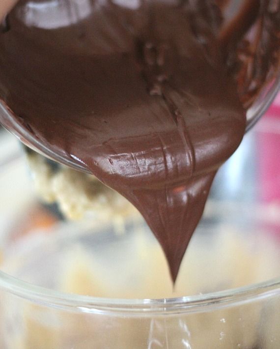 Melted chocolate being poured into a mixing bowl