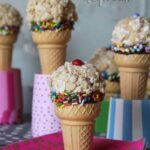 Ice cream cone krispie treats on colorful stands