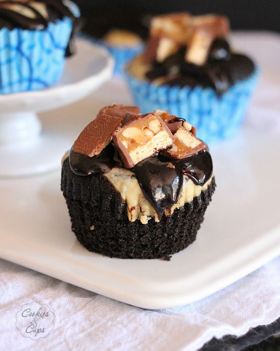 Devil's Food Snickers Cheesecake Cupcakes | www.cookiesandcups.com | #cupcakes #recipes #snickers #cheesecake #devilsfood