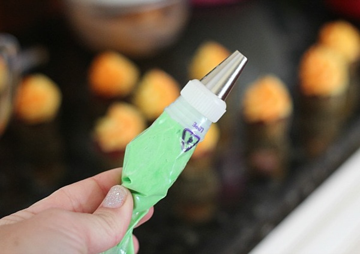 Green frosting in a piping bag