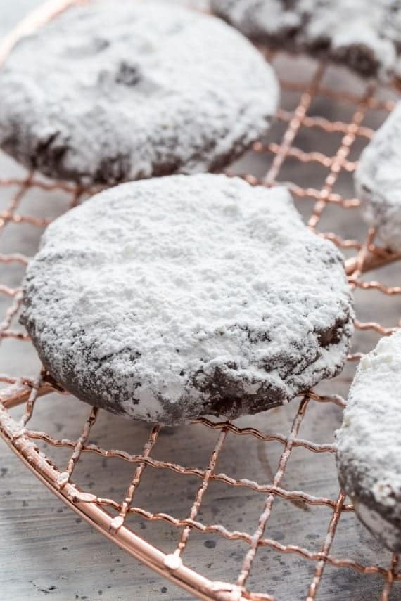 Puppy Chow Cookies! These are a delicious peanut butter cookie coated in chocolate and powdered sugar! The cookie version of the popular snack mix!