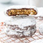 Puppy Chow Cookies stacked with one broken in half