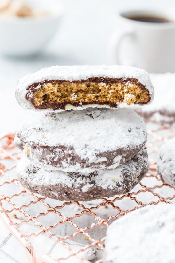 Puppy Chow Cookies stacked with one broken in half