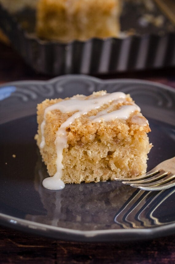 A slice of banana crumb cake with icing