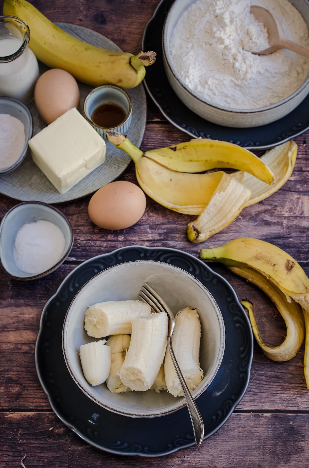 Ingredients for banana crumb cake on a wooden counter