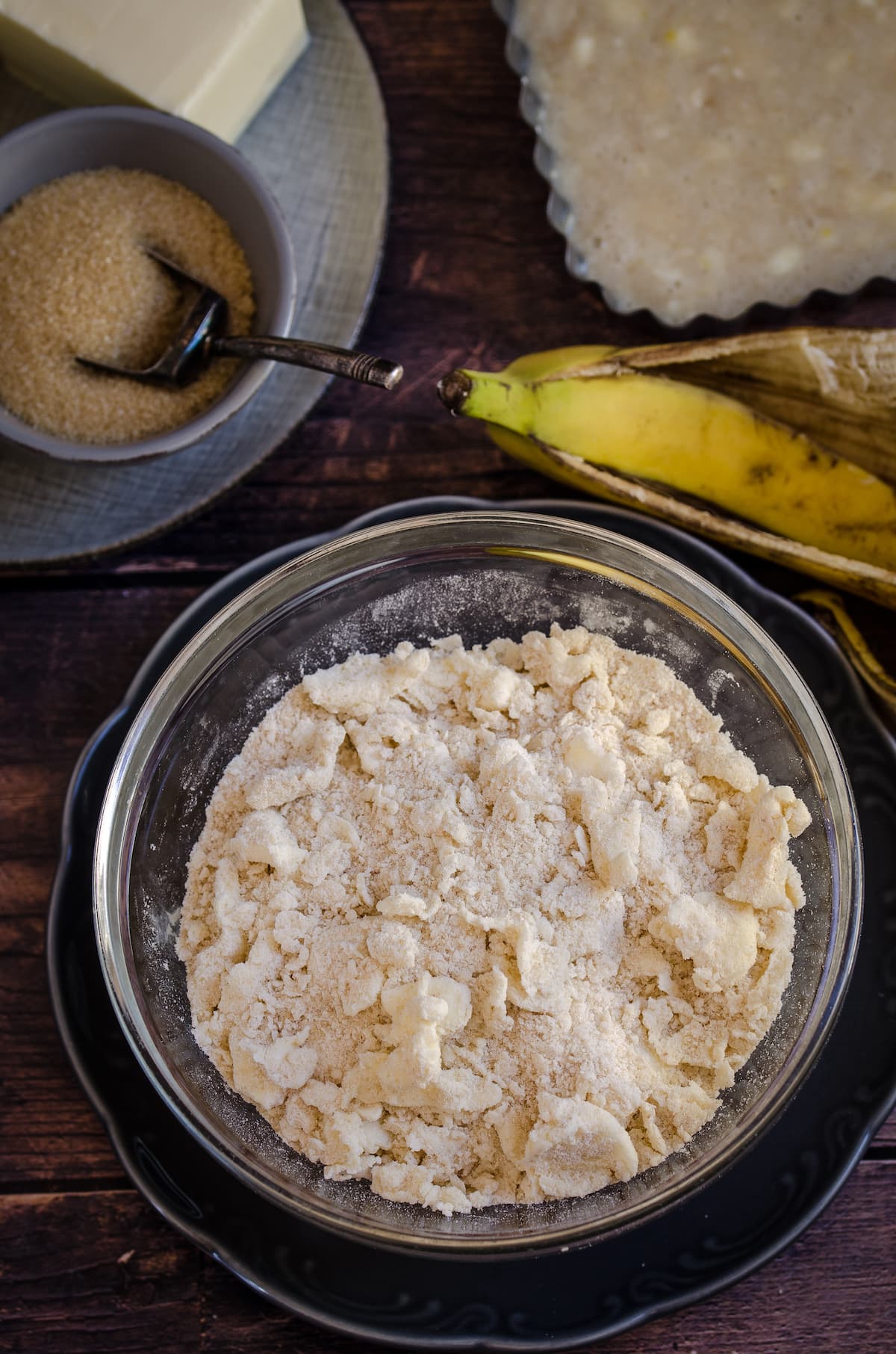 A bowl of dry ingredients being made into banana cake