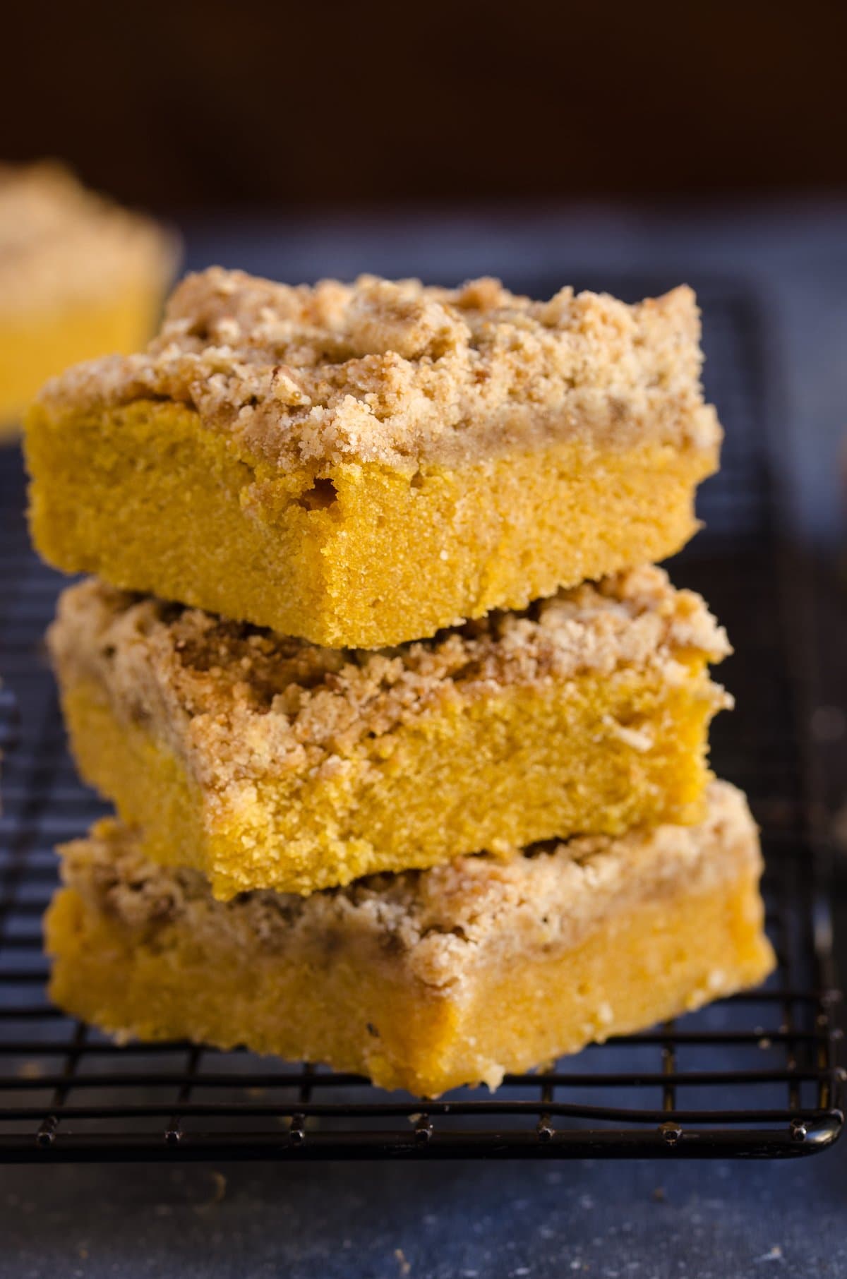 A stack of three slices of pumpkin cake