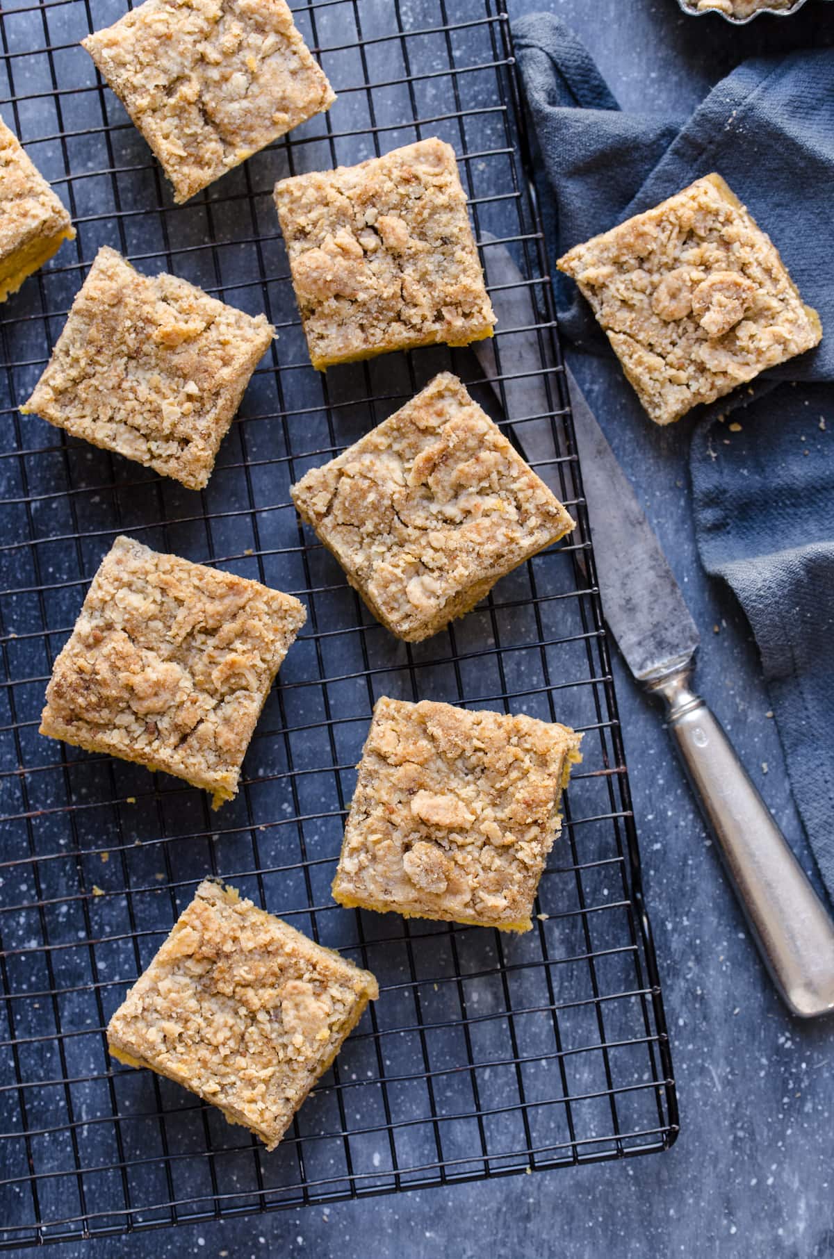 Slices of pumpkin coffee cake on a cooling rack