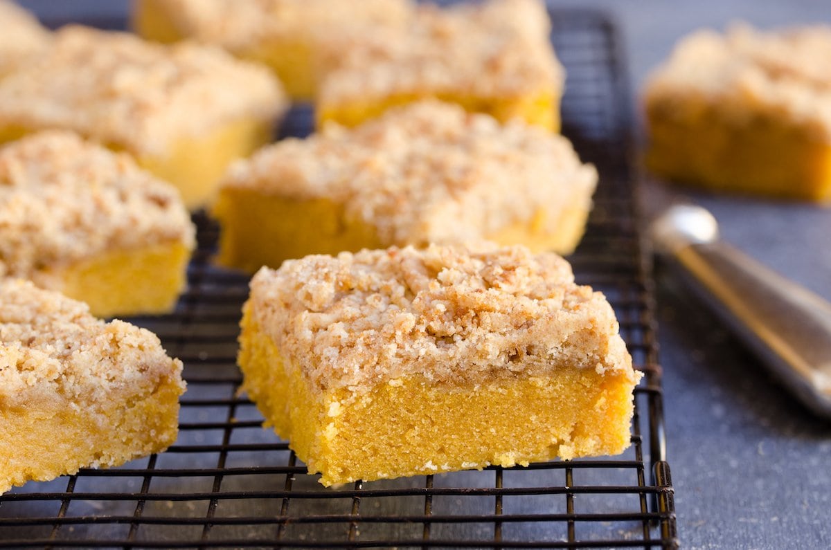 Slices of pumpkin crumb cake on a cooling rack