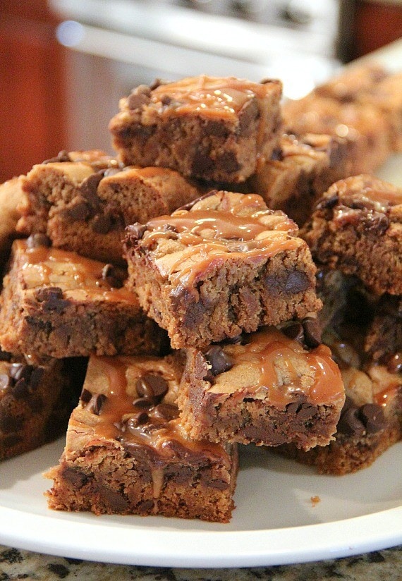 Caramel Peanut Butter Blondies piled on a plate