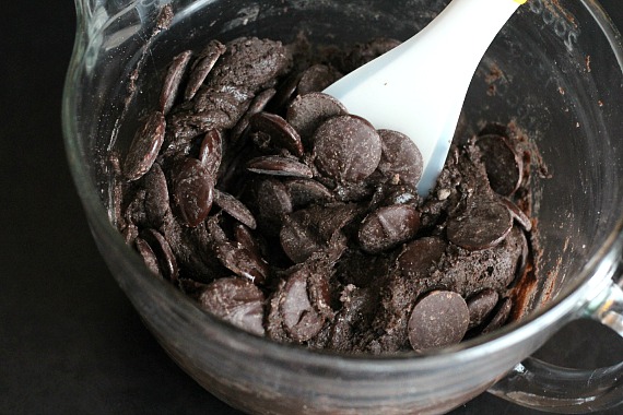 Hershey's Baking Melts are stirred into a bowl of chocolate cake mix brownie batter.