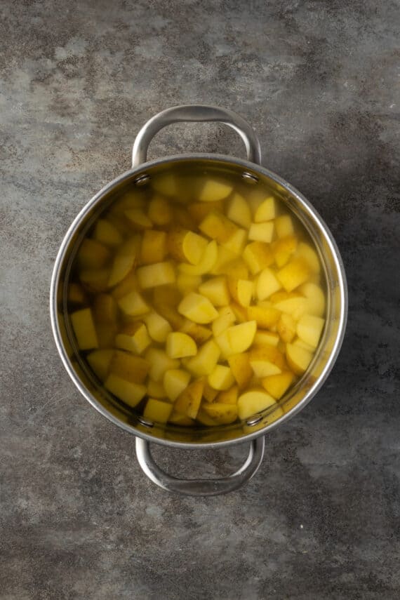 Cut potatoes into a pot of boiling water.