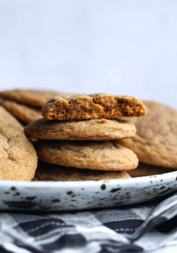 Soft gingerbread cookies stacked on a plate.