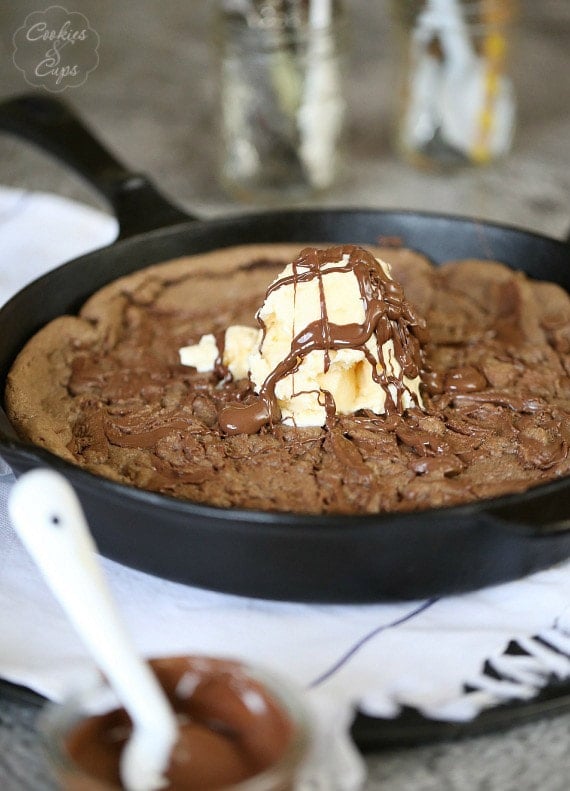 Nutella Skillet Cookie ~ A Chocolate Hazelnut cookie baked right in your cast iron skillet! I a delicious and chocolatey easy dessert! www.cookiesandcups.com