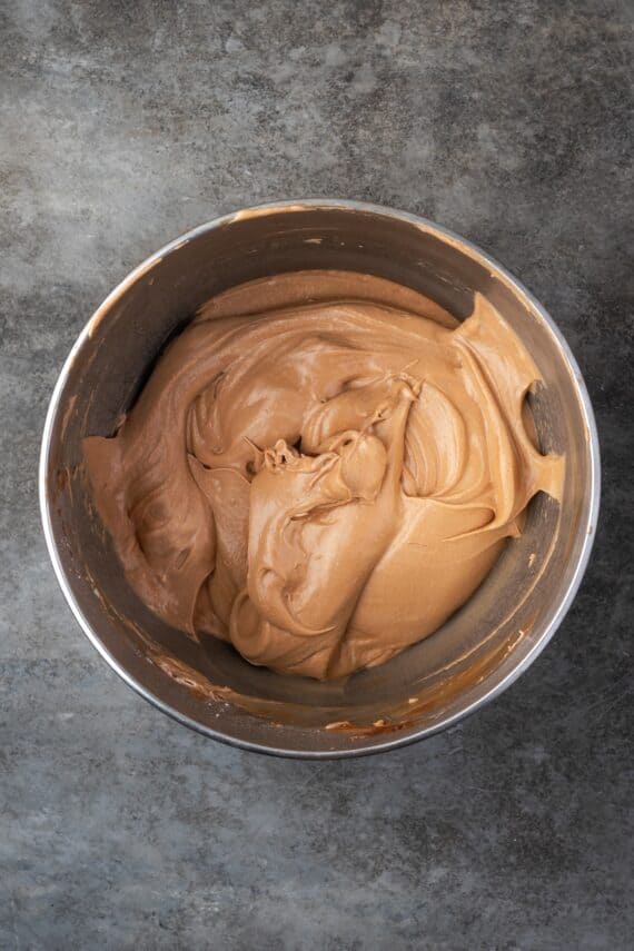 Chocolate hazelnut mousse in a metal mixing bowl.