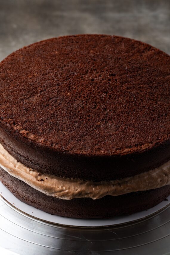 Assembled chocolate hazelnut cake filled with mousse.