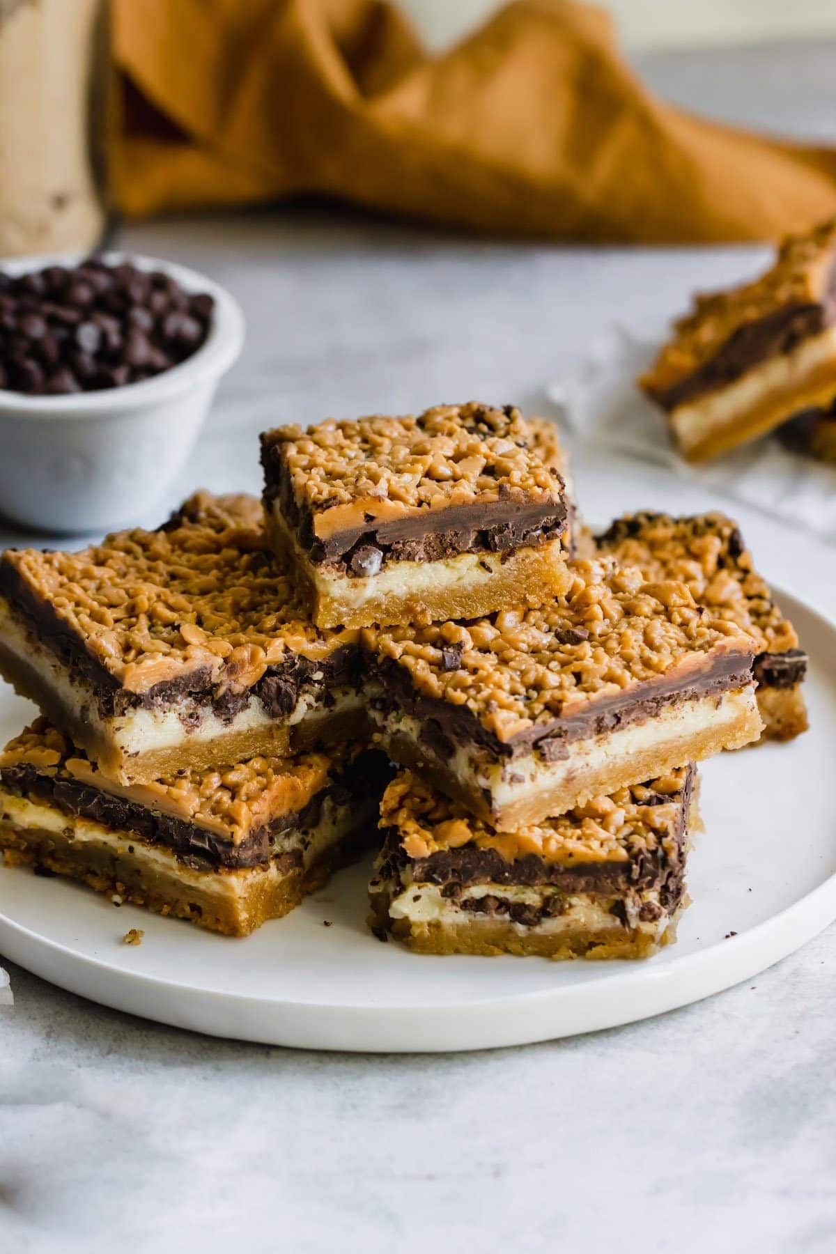 Plate of stacked chocolate cookie bars.
