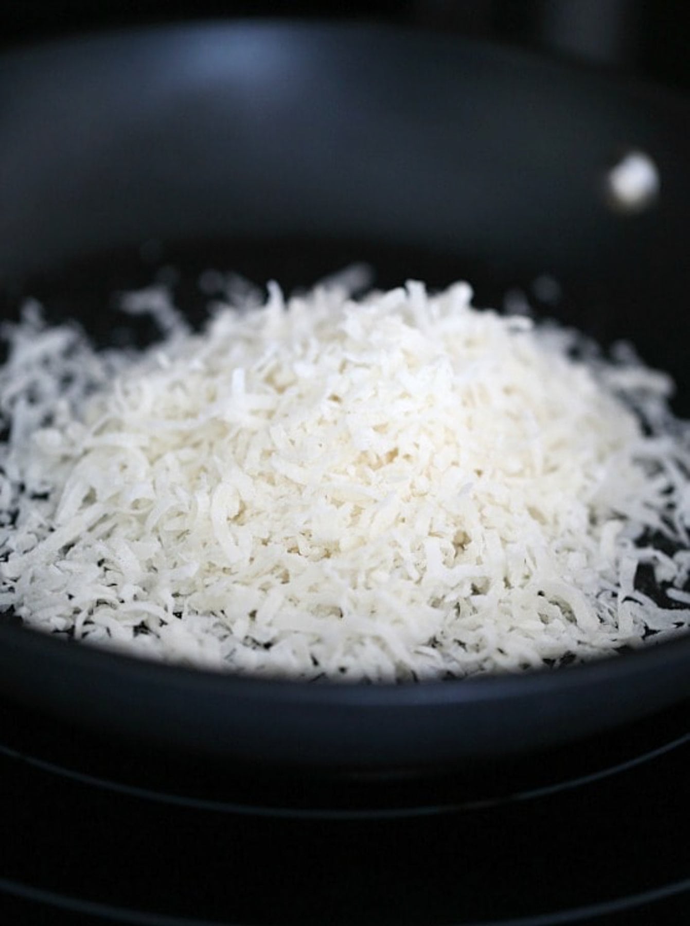 shredded flaked coconut in a nonstick skillet