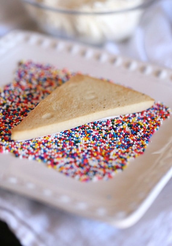 Fairy Toast Cookies ~ A Simple Spin on classic Fairy Toast. It's a buttery cookie topped with a butter frosting and loads of sprinkles!